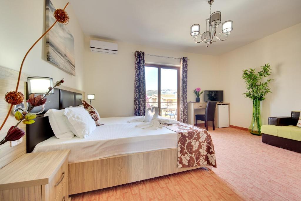 Postel nebo postele na pokoji v ubytování Spa Hotel Montefila