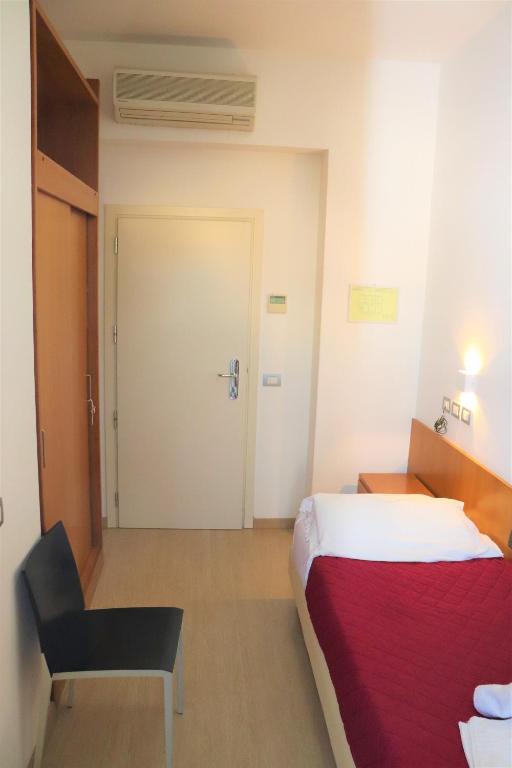 Postel nebo postele na pokoji v ubytování Hotel Morolli