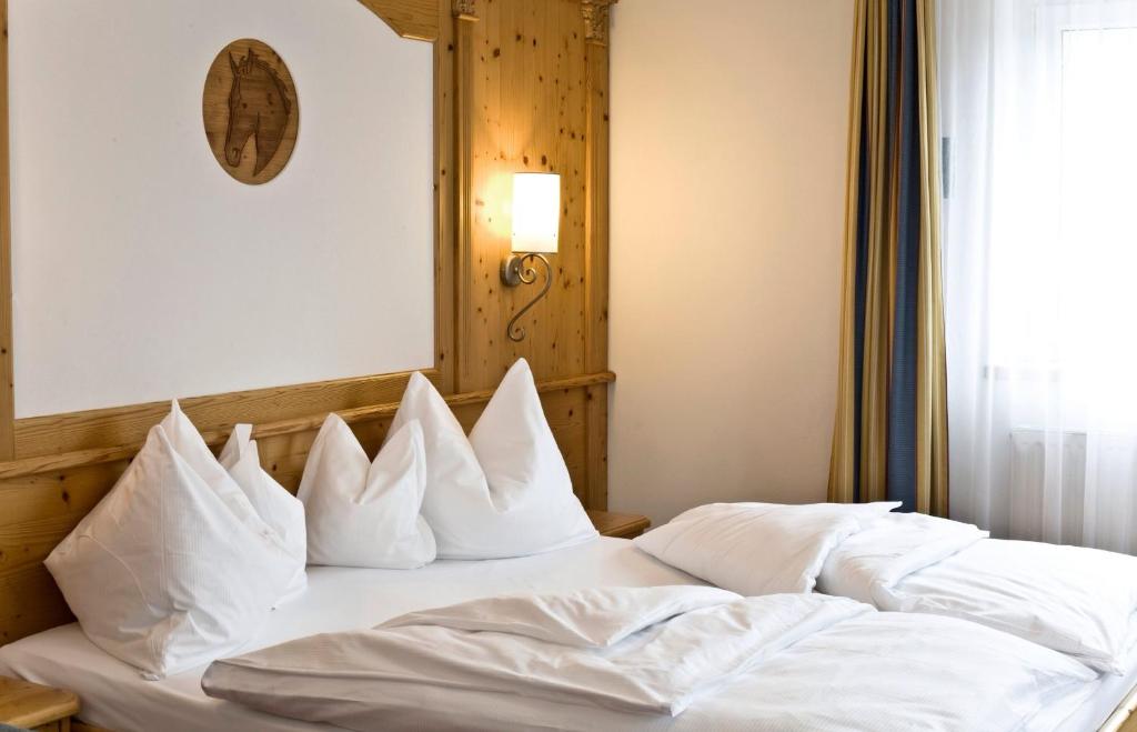 Postel nebo postele na pokoji v ubytování Hotel Rosskopf
