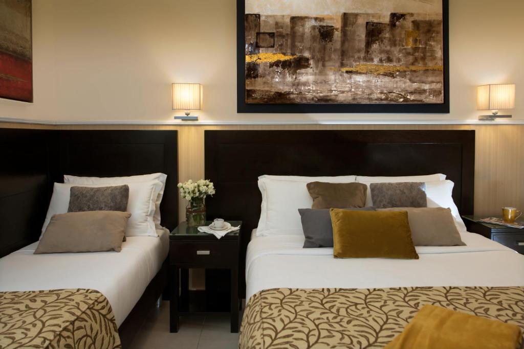 Postel nebo postele na pokoji v ubytování Yes Hotel Boutique Rome