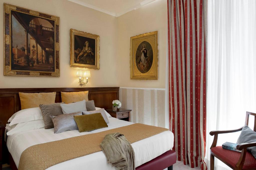 Postel nebo postele na pokoji v ubytování Hotel Des Artistes Roma