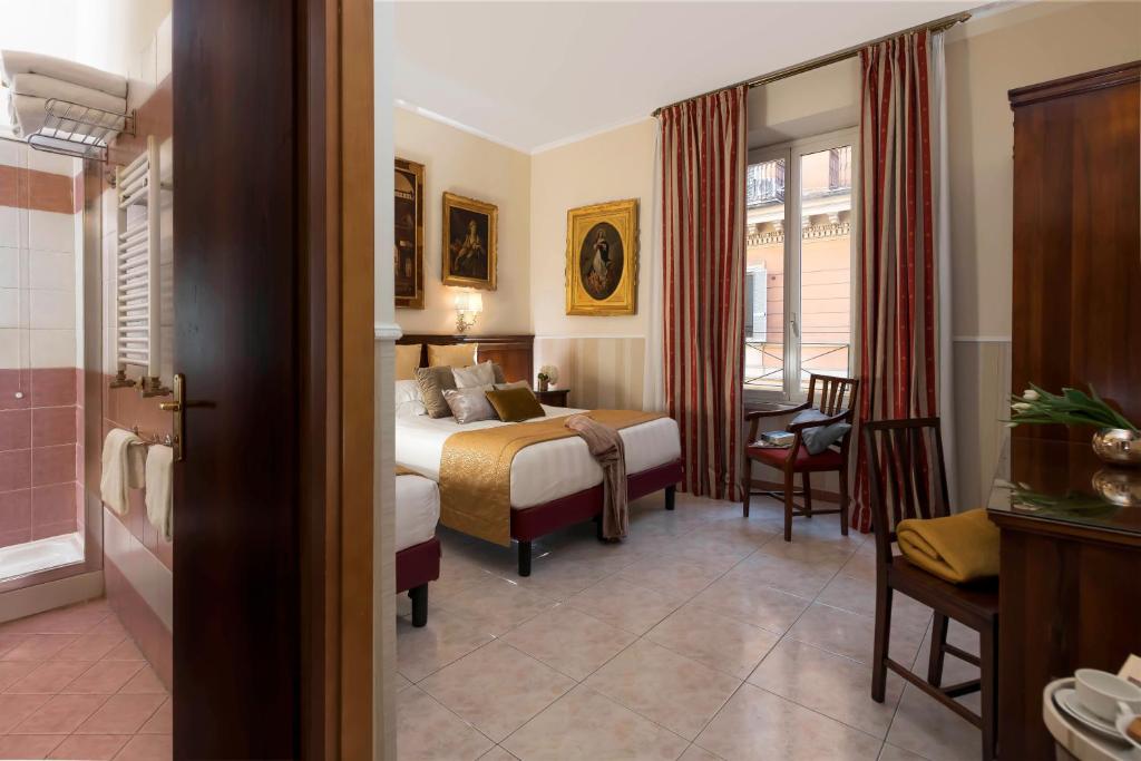 Postel nebo postele na pokoji v ubytování Hotel Des Artistes Roma