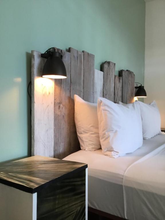 Rúm í herbergi á RIVA B&B