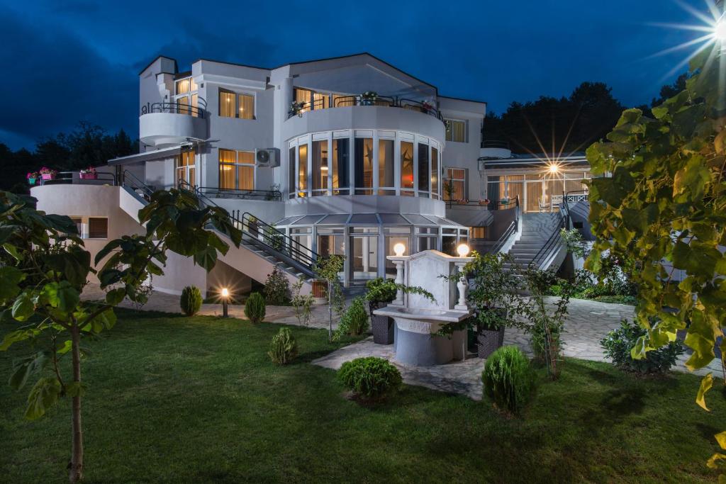 a large white house at night at Вила Франк/Villa Frank in Enina