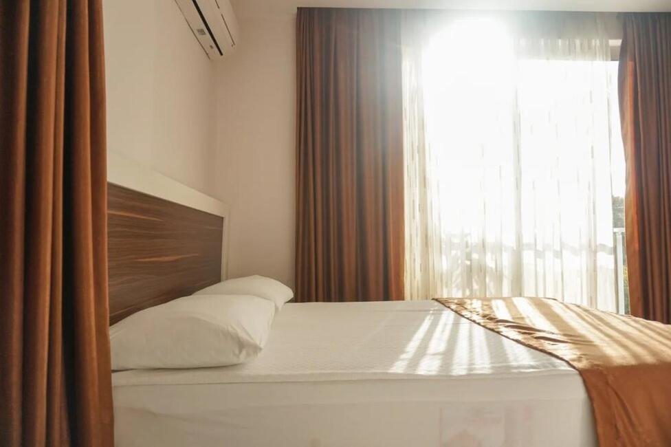 Postel nebo postele na pokoji v ubytování River Hotel
