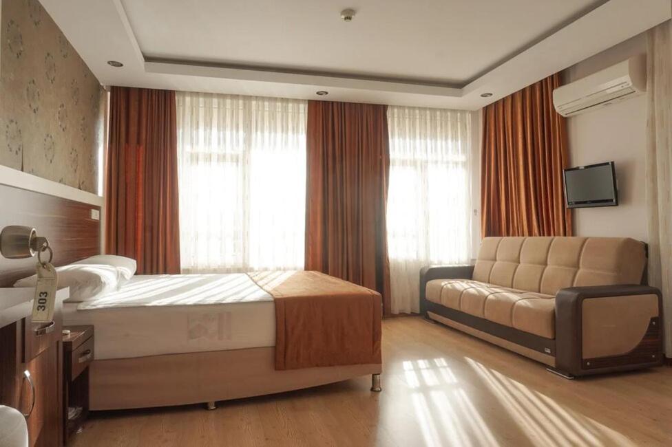 Postel nebo postele na pokoji v ubytování River Hotel