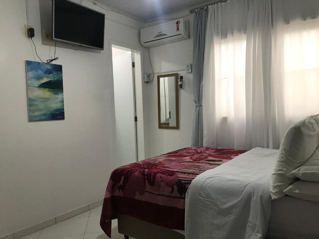 Cama ou camas em um quarto em Residencial Dubai Centro