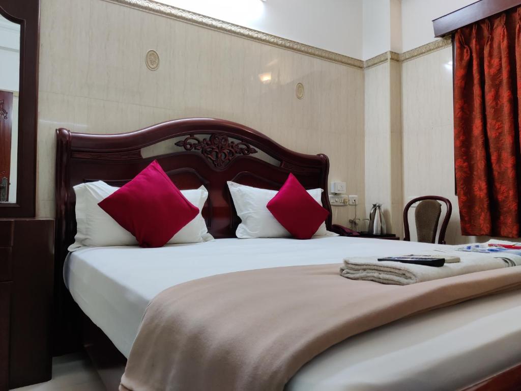 Postel nebo postele na pokoji v ubytování Grand View Residency Chennai