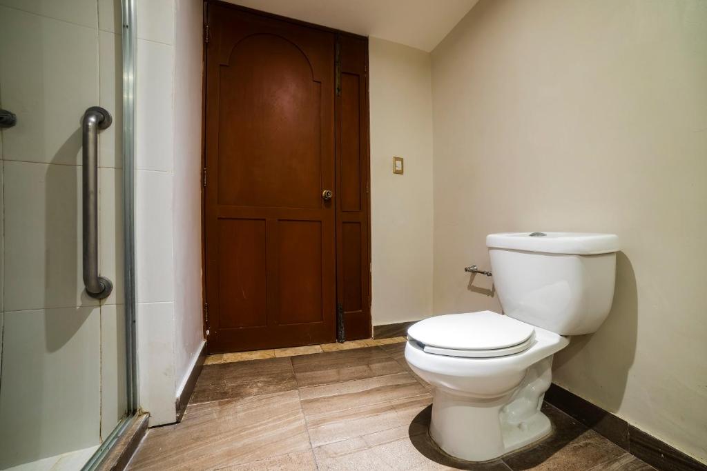 a bathroom with a toilet and a walk in shower at Hotel Imperial in Veracruz