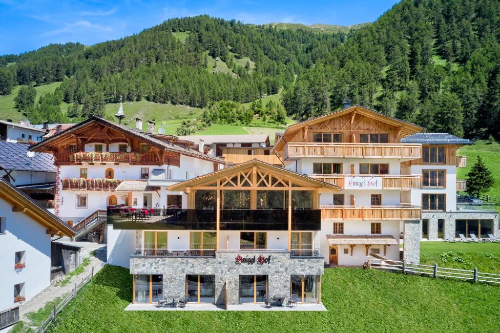 an aerial view of a hotel with mountains in the background at Anigglhof in Malles Venosta