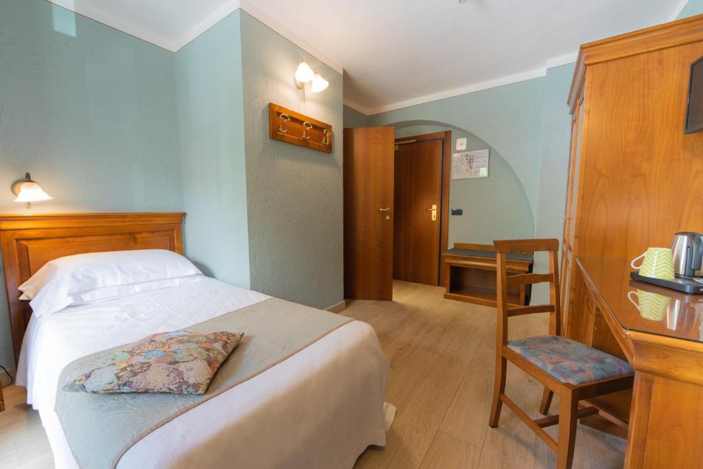 Postel nebo postele na pokoji v ubytování Hotel Du Glacier