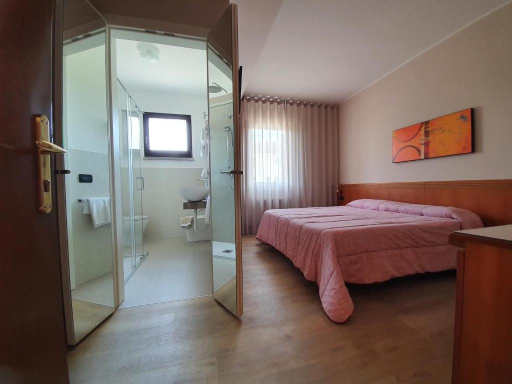 Postel nebo postele na pokoji v ubytování Hotel Prata Verde