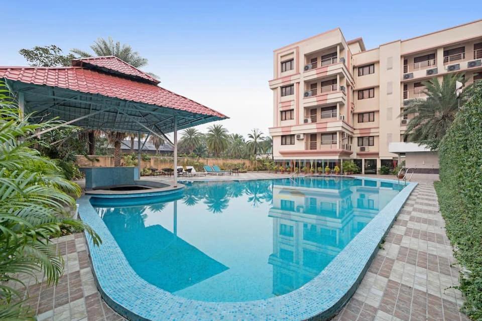 an image of a swimming pool at a resort at LBD RESORTS & HOTELS KOLKATA in Kolkata