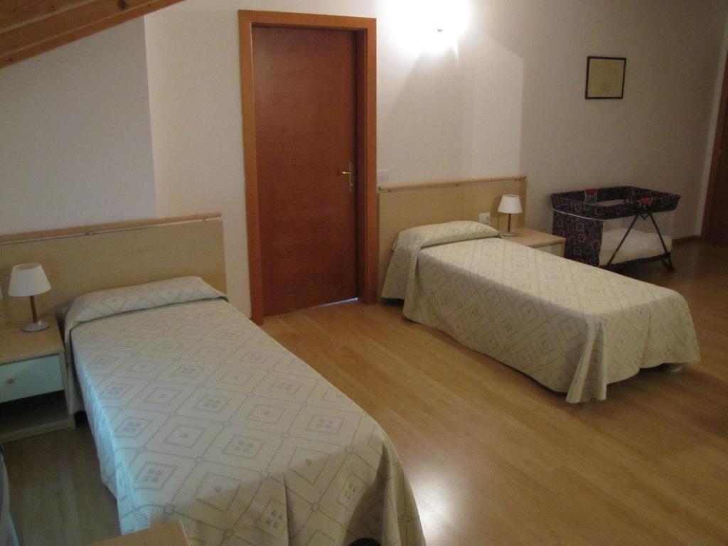 Postel nebo postele na pokoji v ubytování Hotel Scaranò