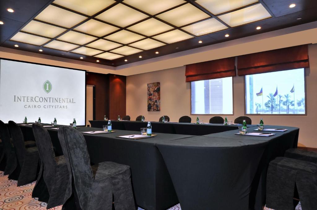 a conference room with a long table and chairs at Intercontinental Cairo Citystars by IHG in Cairo