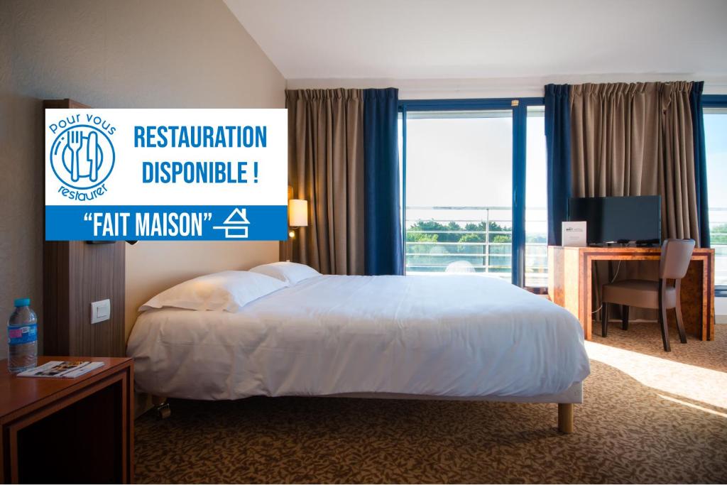 a hotel room with a bed and a sign that reads fair halfway at Brit Hotel Saint Malo – Le Transat in Saint Malo