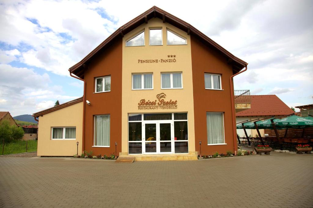 a large building with a sign on the side of it at Becsi Szelet in Miercurea-Ciuc