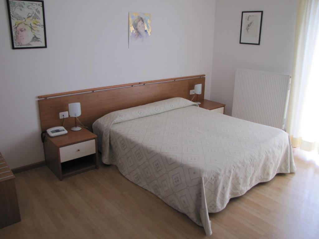 Postel nebo postele na pokoji v ubytování Hotel Scaranò