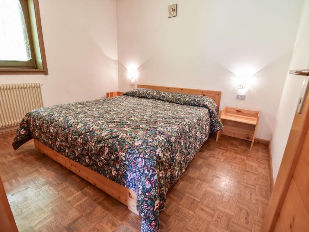 A bed or beds in a room at Apartment Fontanelle-1 by Interhome