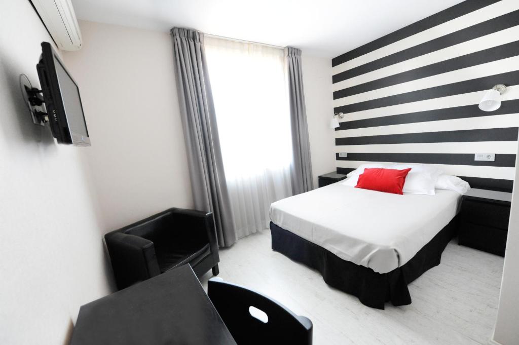 Posteľ alebo postele v izbe v ubytovaní Hotel Domus