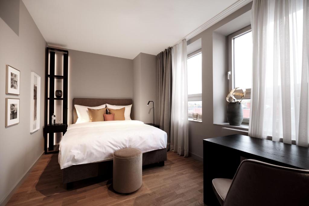 Postel nebo postele na pokoji v ubytování SAXX Hotel "Am Theater Karree"