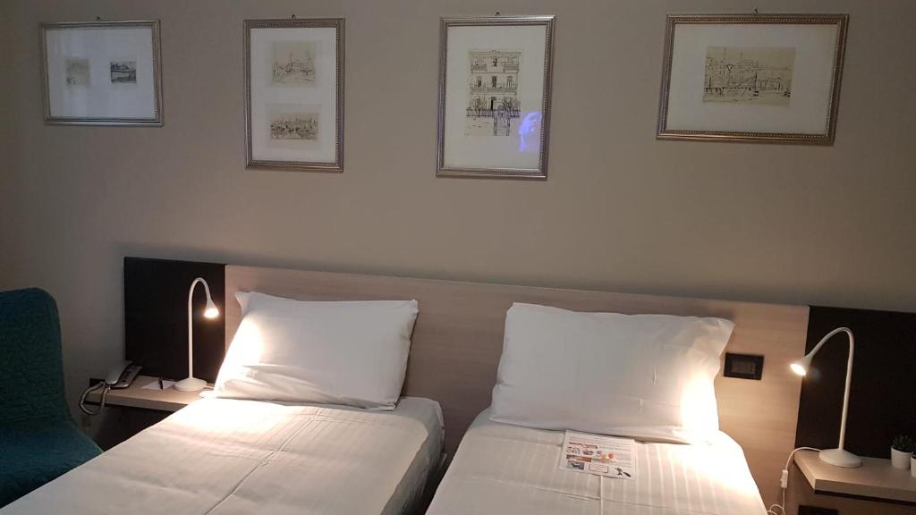 Postel nebo postele na pokoji v ubytování Hotel Gran Torino