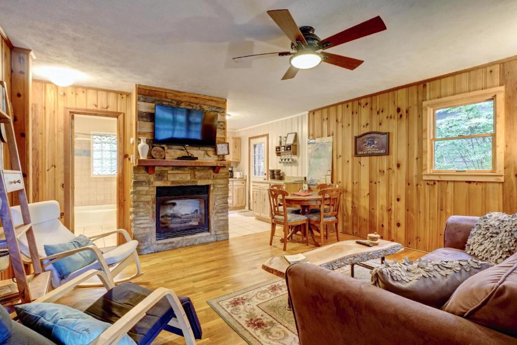 a living room with a couch and a fireplace at Close To Adventure Heart Of Linville Falls in Newland