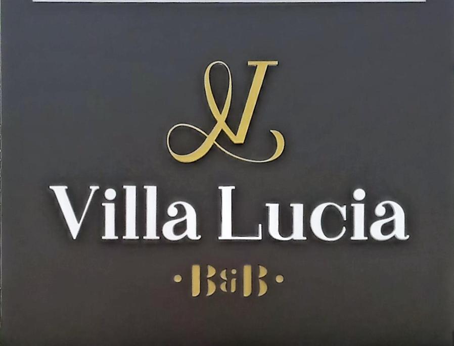 una señal para una sociedad villella lubica en B & B Villa Lucia en Noci