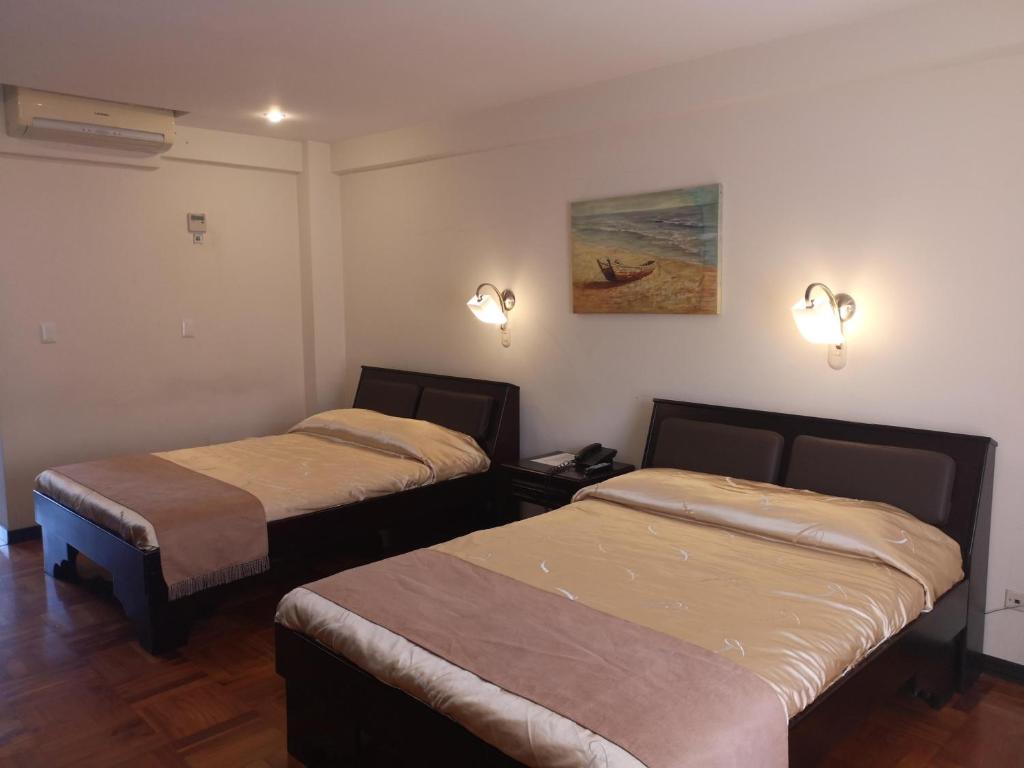 Postel nebo postele na pokoji v ubytování Hotel Plaza Real Suites & Apartments San Jose