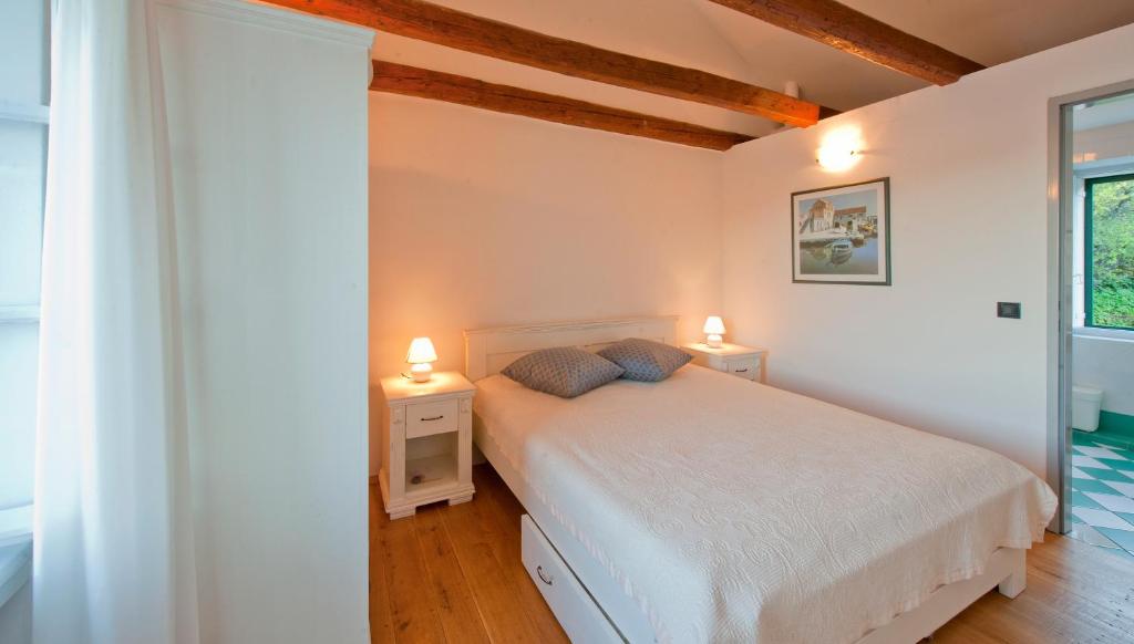 Postel nebo postele na pokoji v ubytování Villa Tangerine Vis