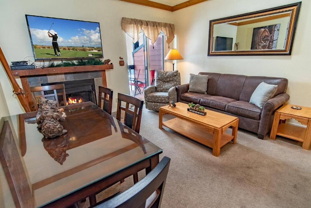 a living room with a couch and a fireplace at Mountainside 343B in Frisco