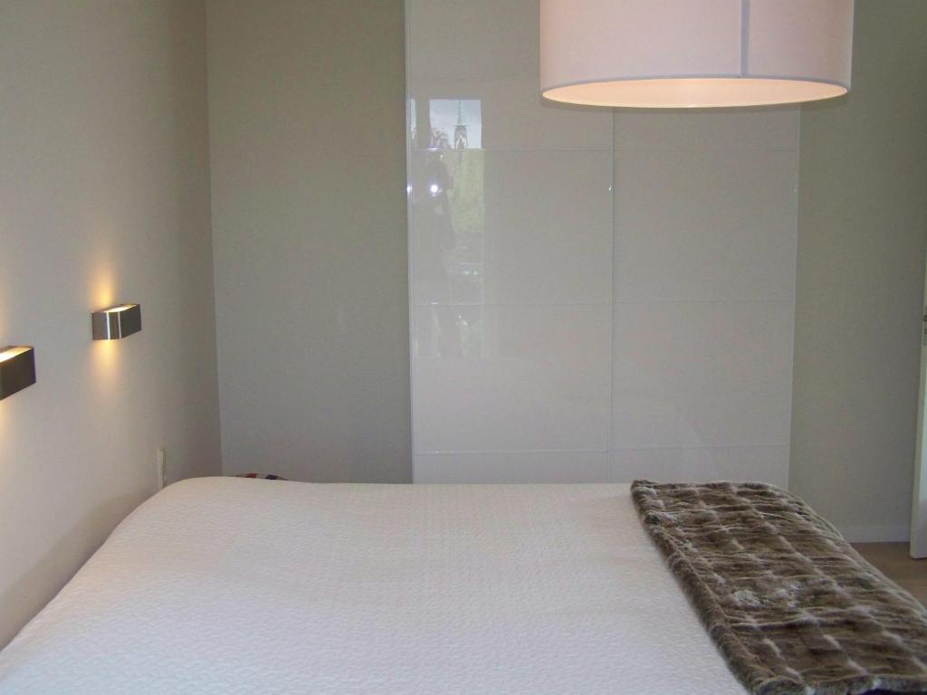 Een bed of bedden in een kamer bij Hotel het Oude Postkantoor