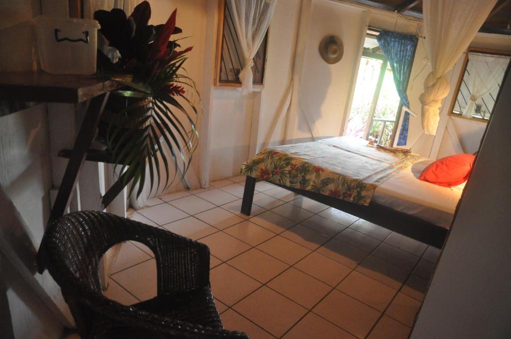 Postel nebo postele na pokoji v ubytování Hibiscus Valley Inn