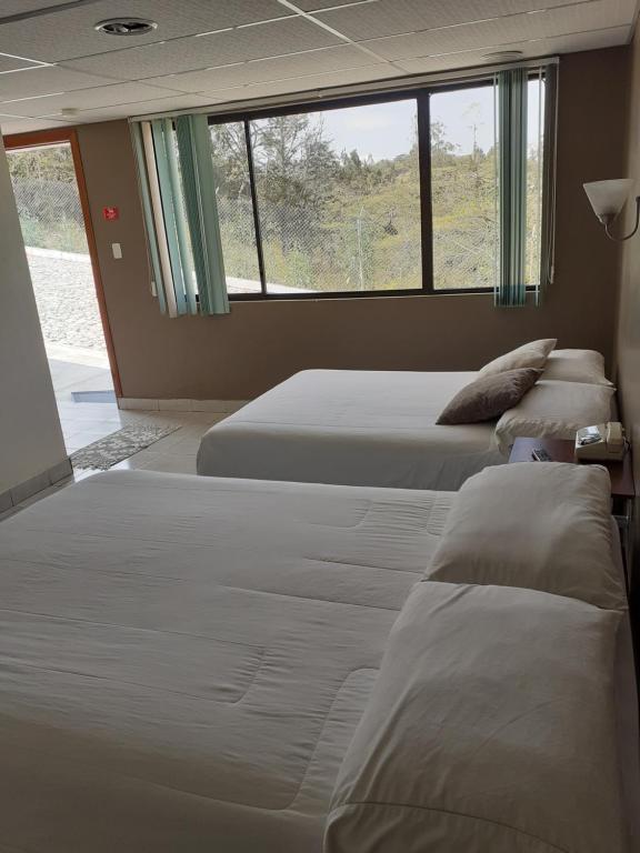 Postel nebo postele na pokoji v ubytování El Balcon de los Reyes