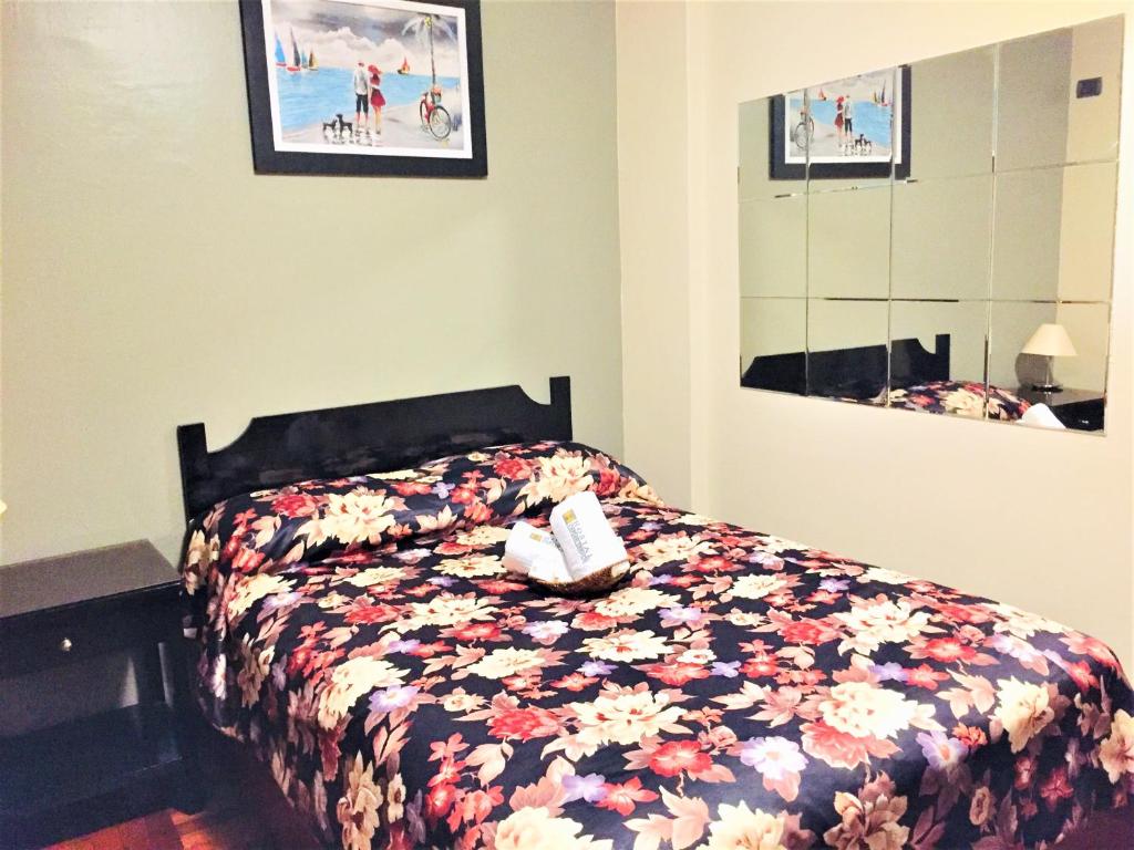 Postel nebo postele na pokoji v ubytování Hostal Carlos Tenaud