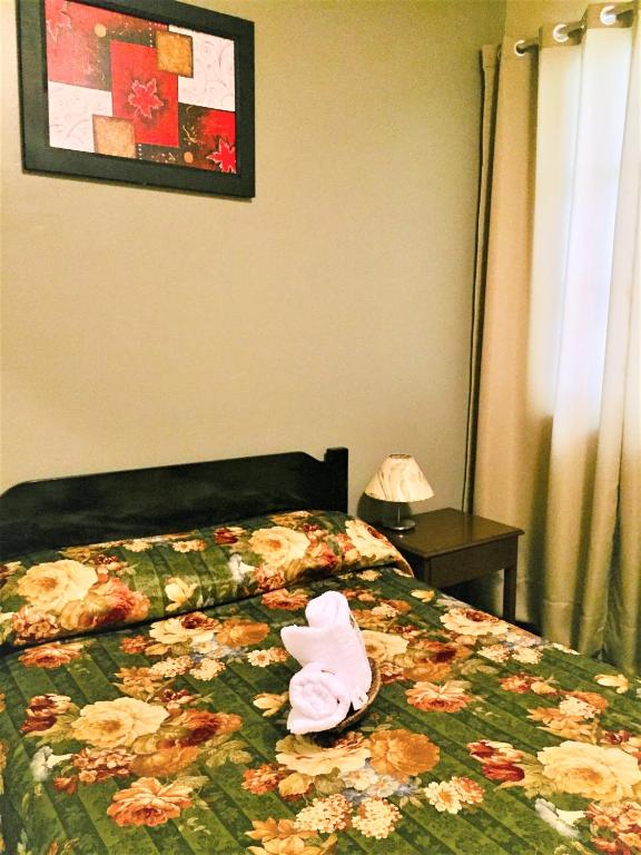 Postel nebo postele na pokoji v ubytování Hostal Carlos Tenaud