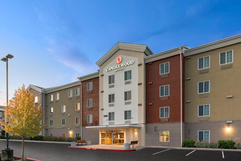 a rendering of a hotel in a parking lot at Candlewood Suites Sumner Puyallup Area, an IHG Hotel in Sumner