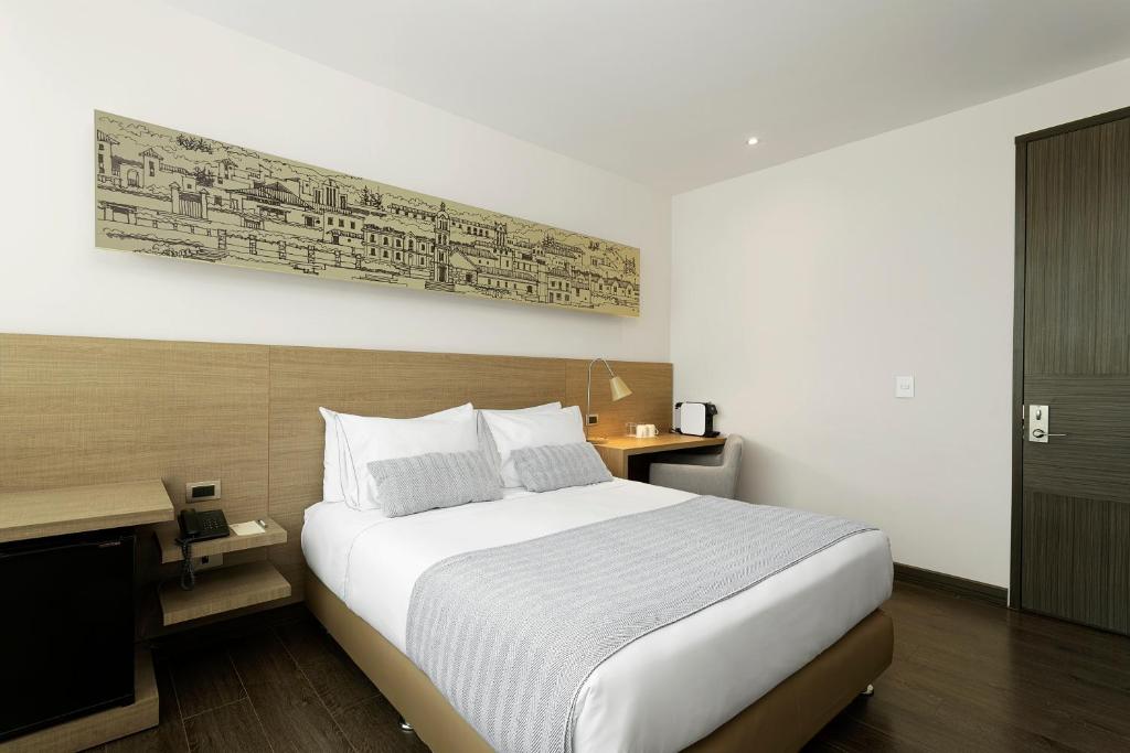 Postel nebo postele na pokoji v ubytování Hotel bh Usaquén