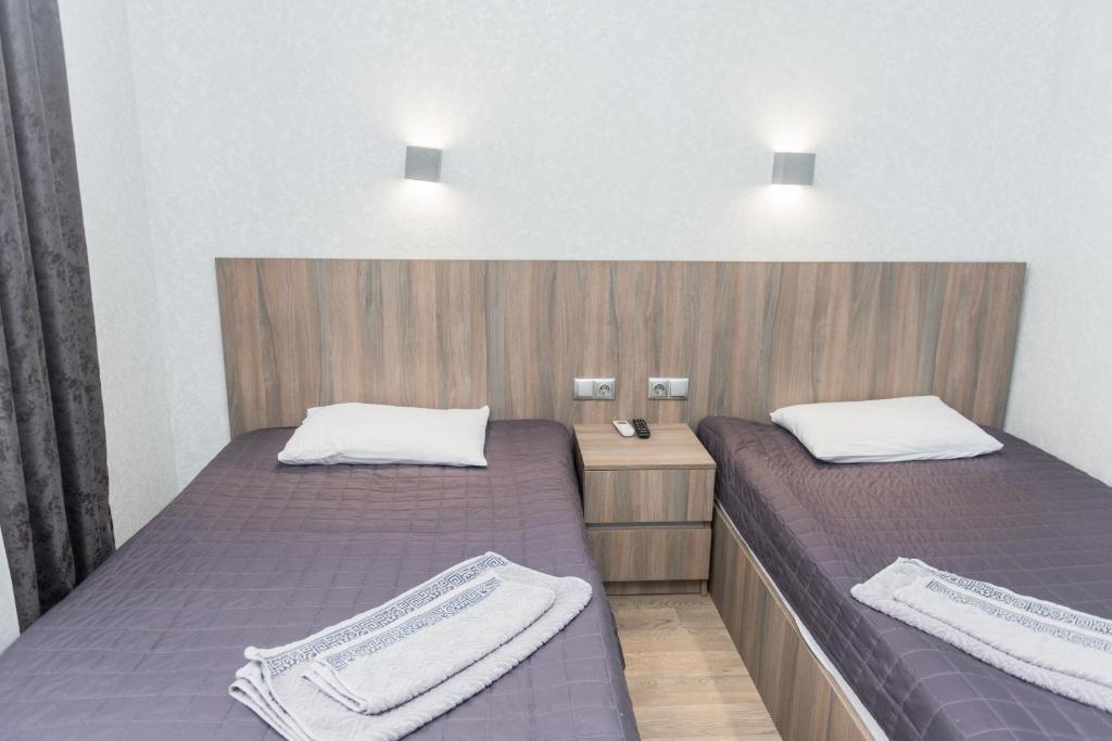 Postel nebo postele na pokoji v ubytování Hotel Voyage Вояж