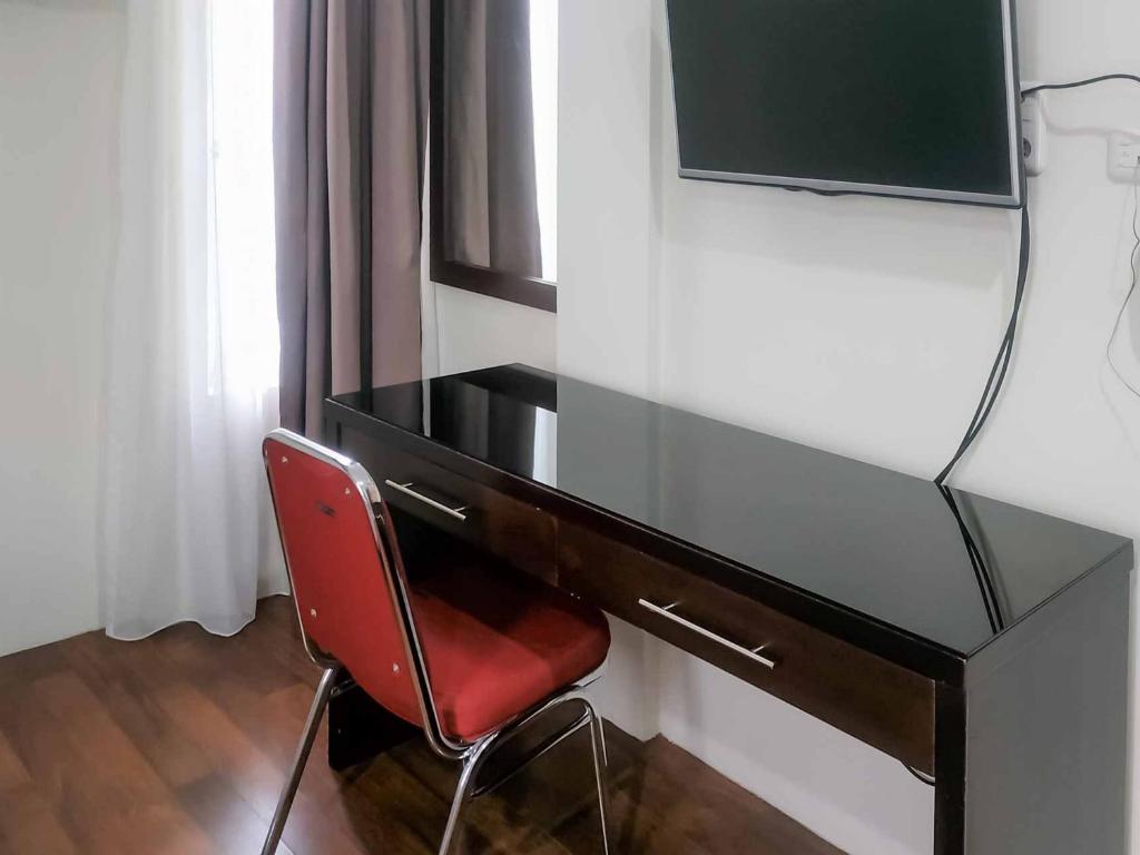 TV o dispositivi per l'intrattenimento presso Avalon Karawaci Mitra RedDoorz