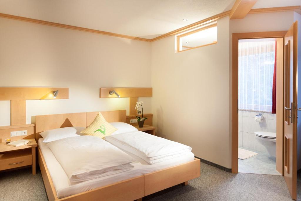 Postel nebo postele na pokoji v ubytování Haus Bstieler