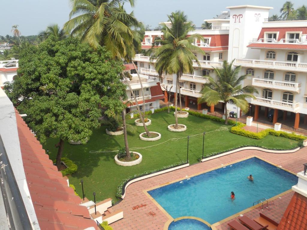 A view of the pool at Vistara By The Beach Goa or nearby