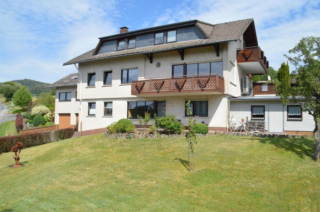 a large house with a large yard at Ferienwohnung Nüdling in Hilders