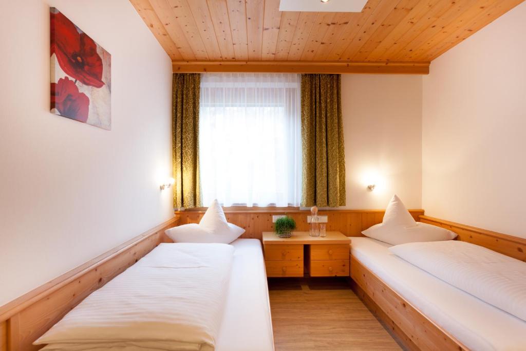 Postel nebo postele na pokoji v ubytování Haus Bstieler