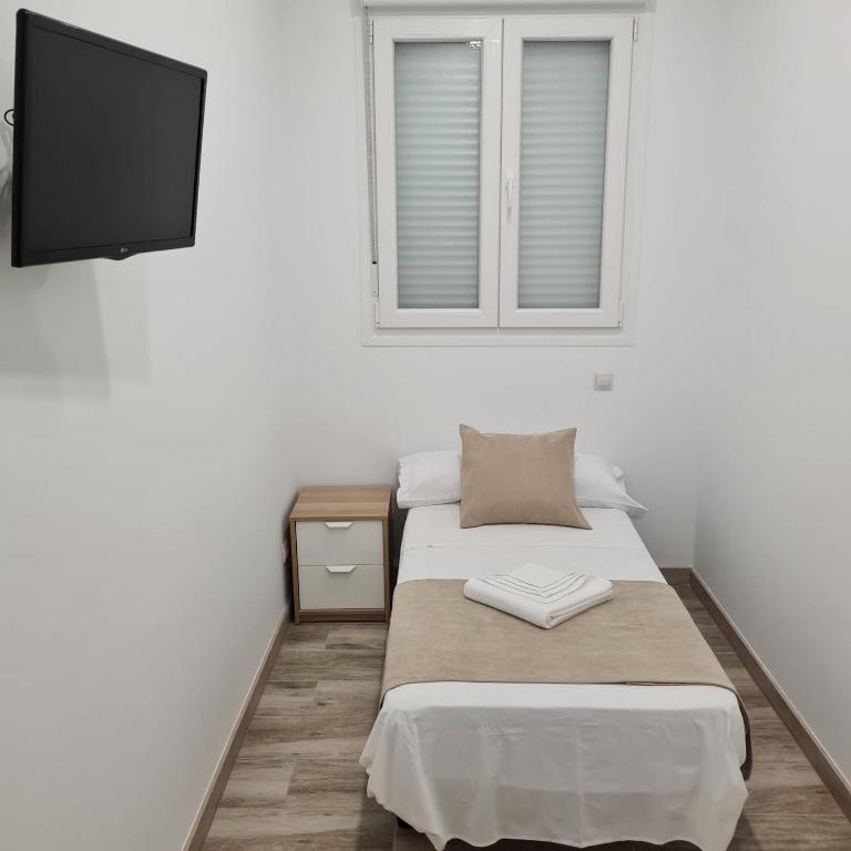 Posteľ alebo postele v izbe v ubytovaní Hostal Las Fronteras