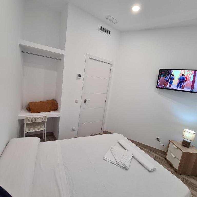 Posteľ alebo postele v izbe v ubytovaní Hostal Las Fronteras