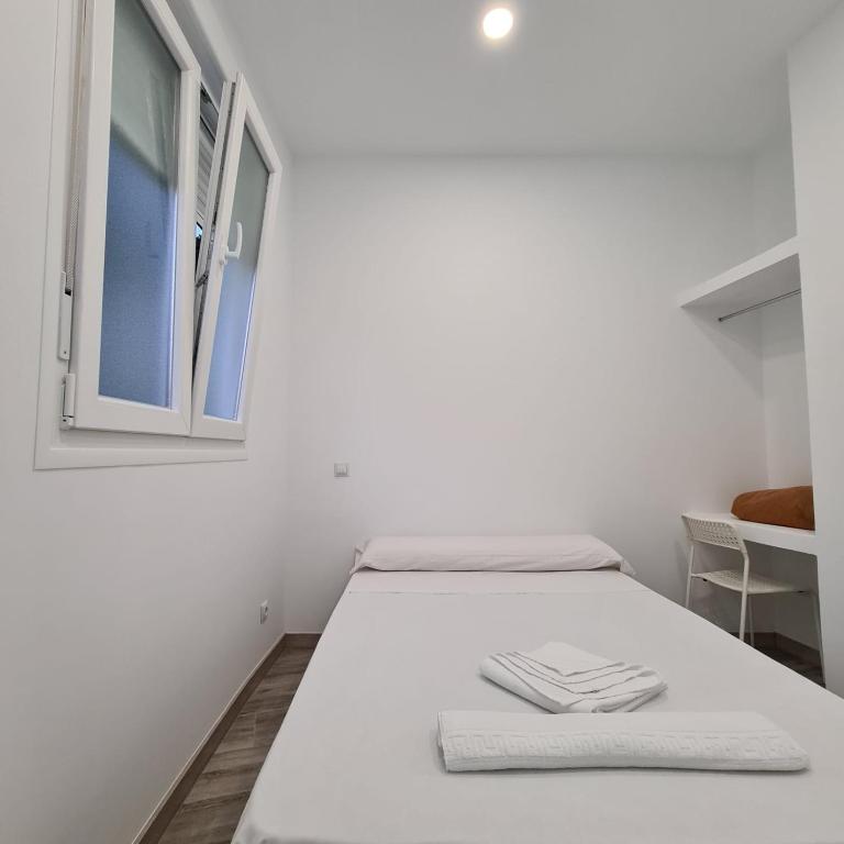 Posteľ alebo postele v izbe v ubytovaní Hostal Las Fronteras