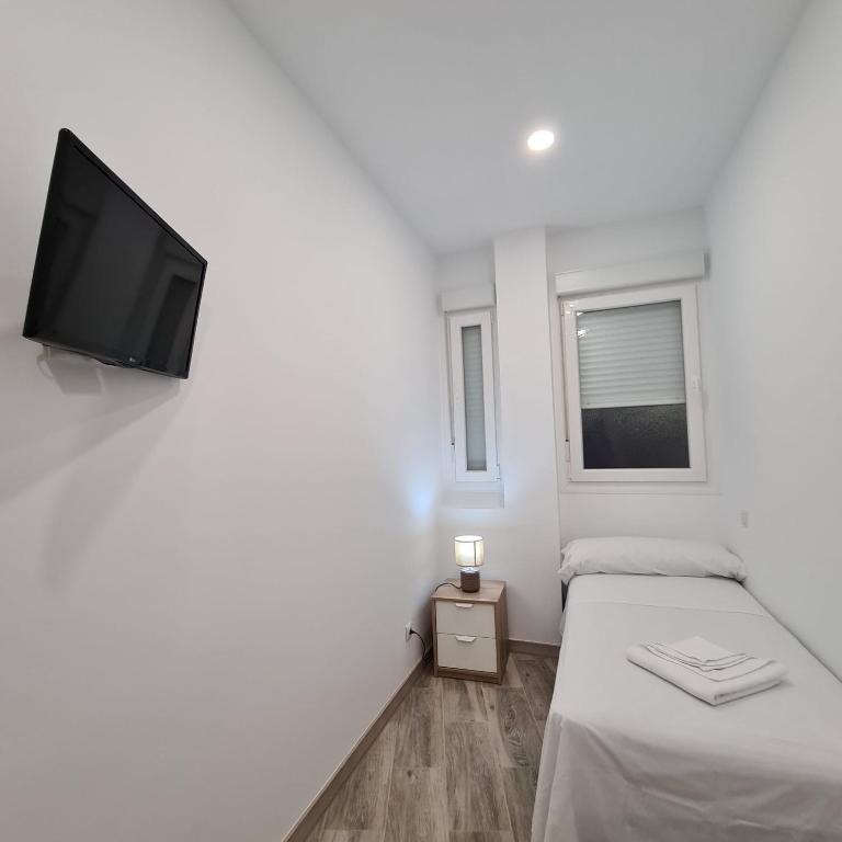 Posteľ alebo postele v izbe v ubytovaní Hostal Las Fronteras