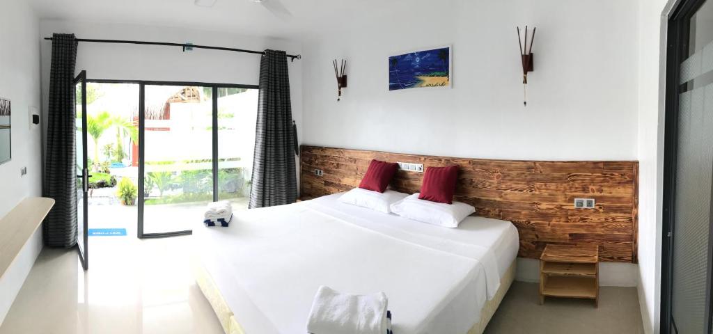 Postel nebo postele na pokoji v ubytování Royal Stay Inn