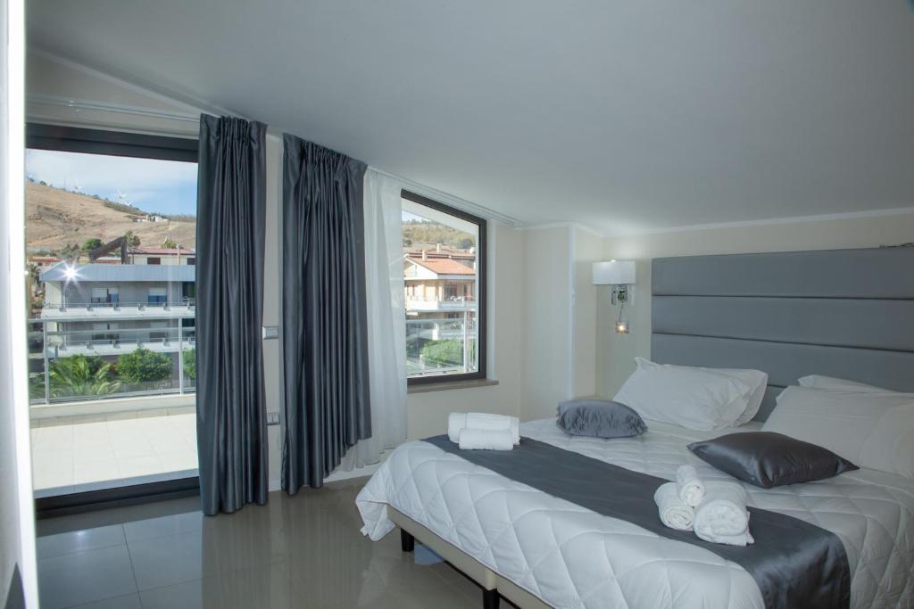 Postel nebo postele na pokoji v ubytování Hotel Dolce Stella